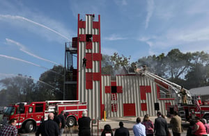 Firefighting training props in use during live burn building training exercises with ventilation and rescue operations