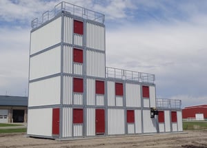 Fire training facility design with multi-level modular training tower and ground-level structure